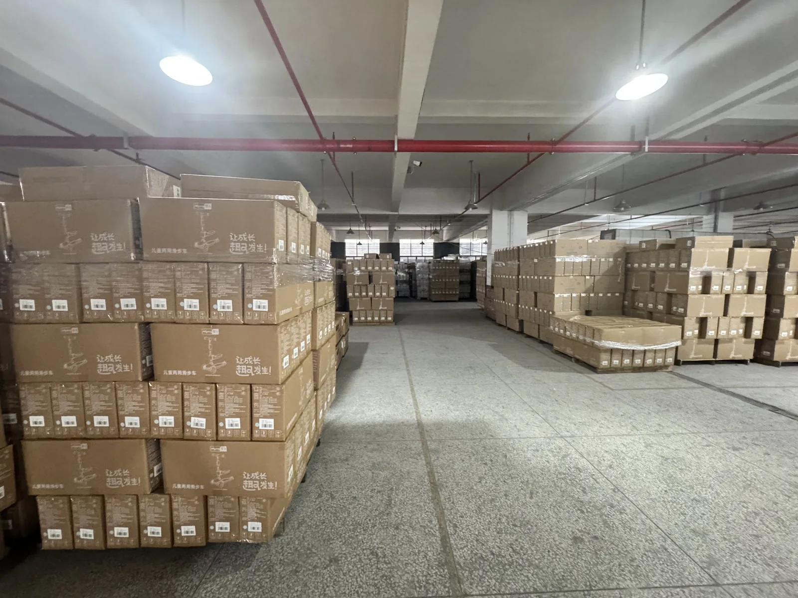 Packed kids scooters stored in the finished goods warehouse