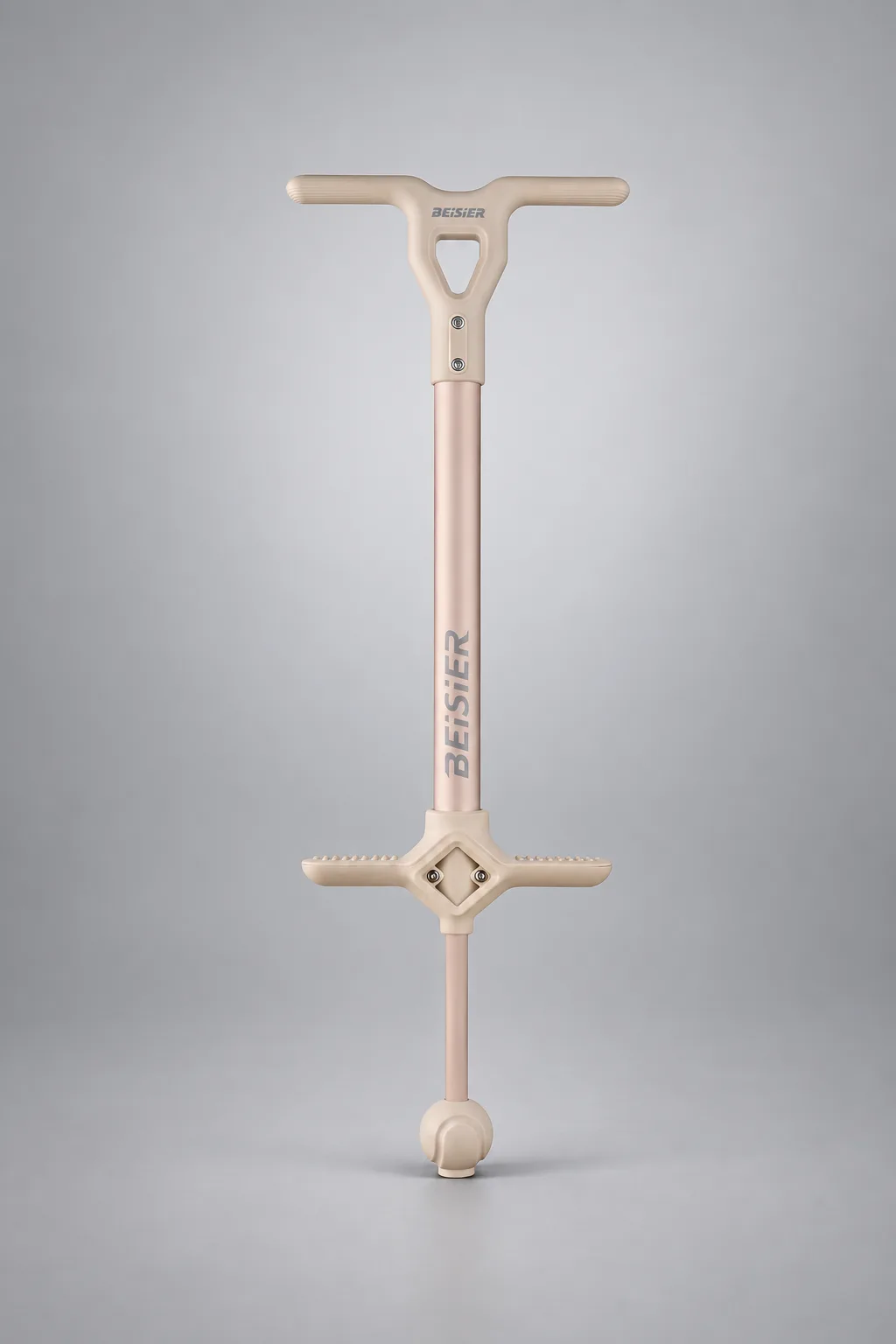 Cream kids pogo stick on a silver-gray studio background