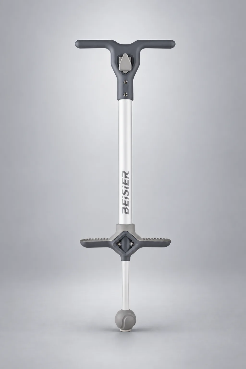 Gray and white kids pogo stick on a silver-gray studio background