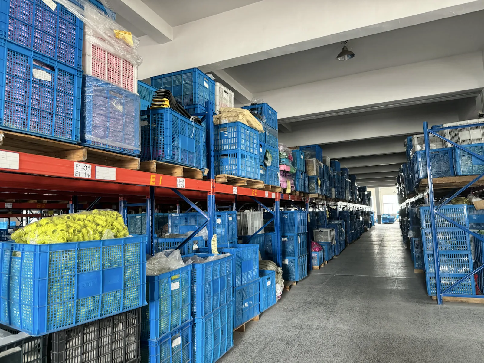 Organized warehouse storage for kids scooter components and production materials